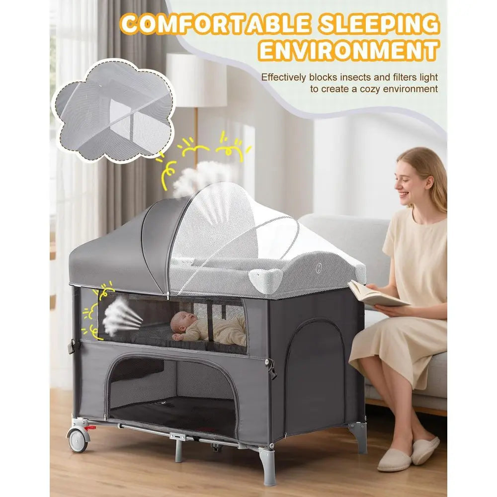 All-in-One Grey Bedside Bassinet with Play, Crib, Changer, Storage, Mosquito Net, Toy Bar for Newborns to Toddlers